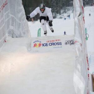 A man performs a trick on a ramp, showcasing his skills and balance in an impressive display of athleticism.